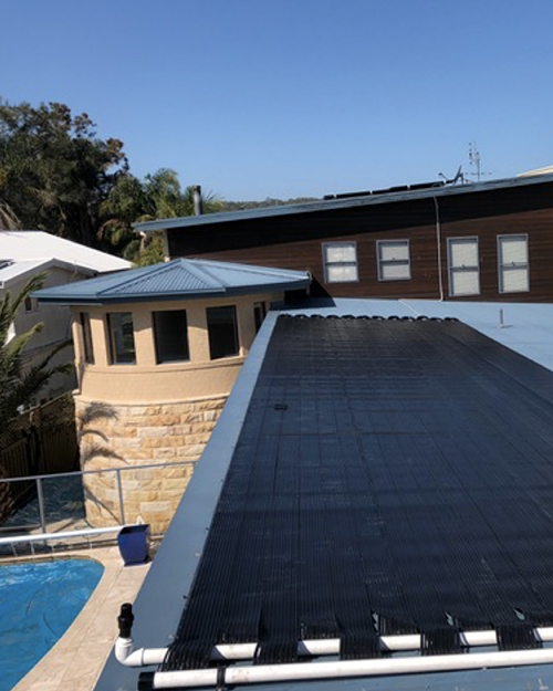 Solar Heating with beautiful pool on picturesque backdrop